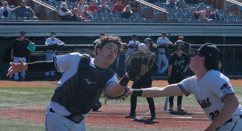 Juneau-Douglas High School: Yadaa.at Kalé senior catcher Nate Fick and senior first baseman Riley Fick go for a foul ball against Colony during the Crimson Bears' 8-3 win over the Knights in the opening game of the ASAA DI Baseball State Championships at Anchorage's Mulchay Stadium on Thursday, June 4, 2026. (Klas Stolpe / Juneau Independent)