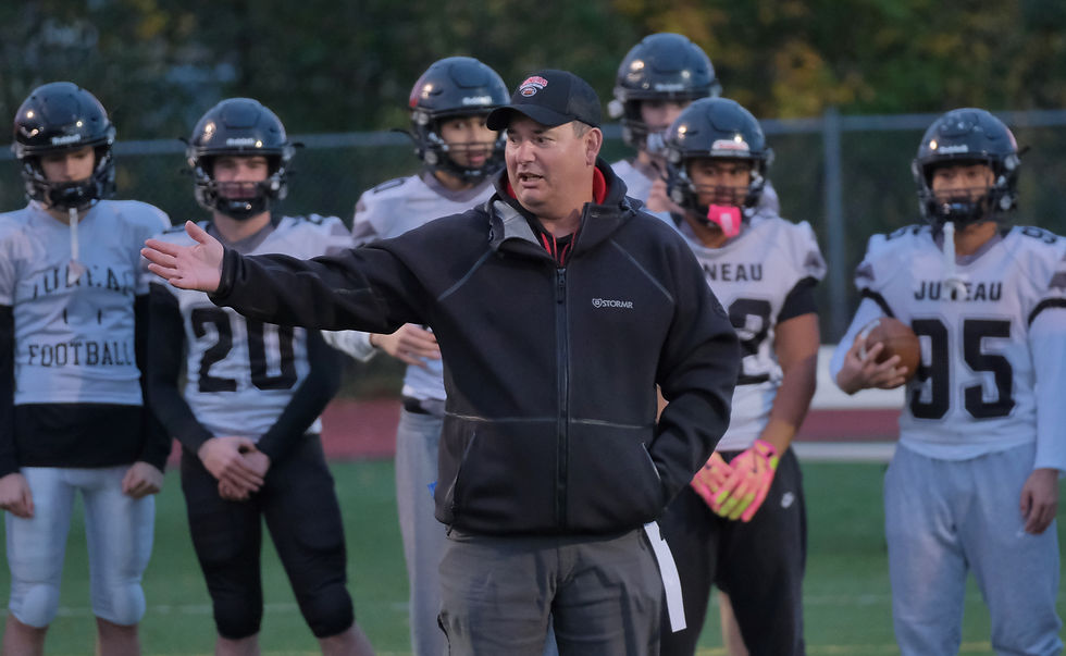 Juneau-Douglas High School: Yadaa.at Kalé head coach Rich Sjoroos gestures to his coaching staff on Wednesday after announcing his selection as Cook Inlet Conference Coach of the Year. JDHS will host East Anchorage in the CIC playoff quarterfinals at the Adair-Kennedy Memorial Park field at 7 p.m. Saturday, Oct. 10, 2026. (Klas Stolpe / Juneau Independent)
