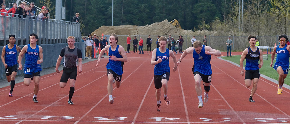 Sitka senior Justin Kitka, Sitka freshman Koen Hirai, Ketchikan senior Evan Dash, Petersburg junior Ben Kandoll, Sitka sophomore Andrew Mullin, Petersubrg junior Jakob Preisler, Petersburg senior Brayden Tucker and Sitka senior Zander Dumag race the boys 100-meter dash during the Capital City Invitational at Thunder Mountain Middle School’s Falcons Stadium, Saturday, May 16, 2026. (Klas Stolpe / Juneau Independent)
