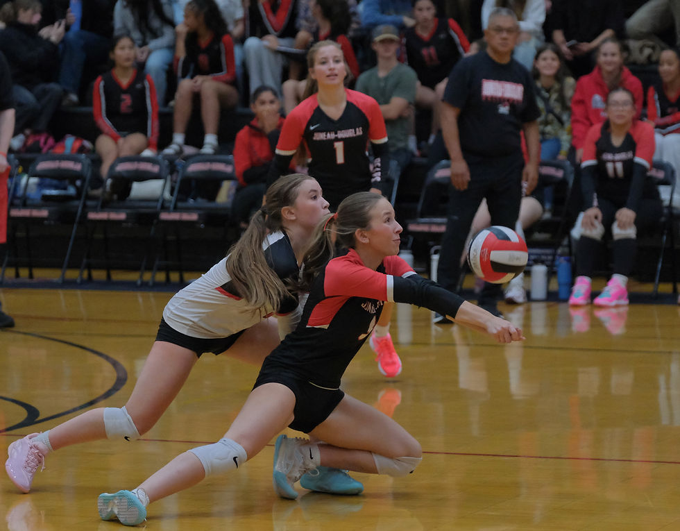 JDHS sophomore Winter Osterhout (2) and senior Bri Powers react to a Sitka serve during the Crimson Bears' 3-0 (25-15, 25-21, 25-17) match win over the Wolves at the George Houston Gymnasium on Friday, Aug. 21, 2026. (Klas Stolpe / Juneau Independent)