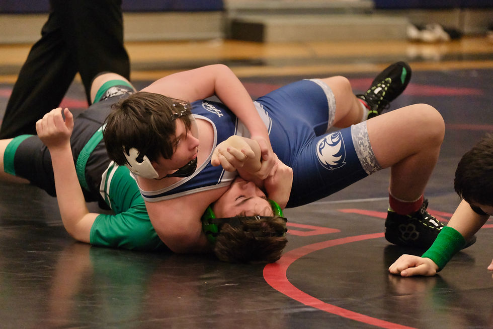Thunder Mountain's Matvii Kozodoi attempts to pin Haines Middle School's Charlie DeWitt in their 148-pound match during the Harben Invitational at TMMS on Saturday, Feb. 14, 2026. (Klas Stolpe / Juneau Independent)
