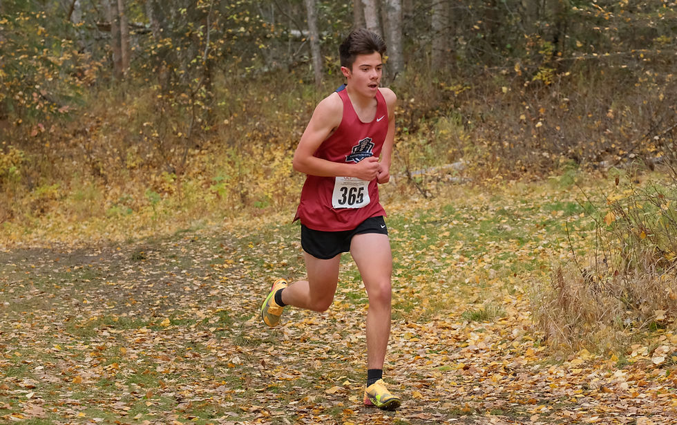Mountain City Christian Academy junior Breyden Nottingham runs alone in the lead of the Division II boys Alaska State XC Championships at Anchorage's Bartlett High School trails, Saturday, Oct. 3, 2026. Nottingham won his second straight title, finishing in 16:20. (Klas Stolpe / Juneau Independent)
