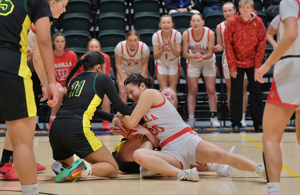 Wasilla senior Katie Jackson (30) battles for a loose ball with Service junior Karlierose Lealaisalanoa (11) and freshman JJ Schmidlkofer during their opening game at the 2026 ASAA March Madness Alaska State Basketball Championships on Wednesday, March 18, 2026. (Klas Stolpe / Juneau Independent)