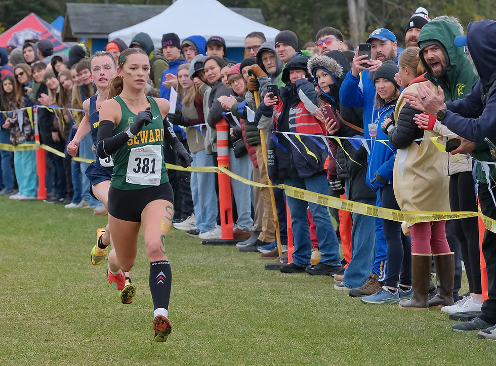 Seward junior Olive Jordan (381) and Homer sophomore Ariella Garvey sprint to the finish of the ASAA Division II girls state cross country championships at Anchorage's Bartlett High School Trails on Sat. Oct. 3, 2026. (Klas Stolpe / Juneau Independent)