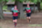 Juneau's Tracy and Aaron Morrison run at Moran State Park in their swim gear during a 2025 SwimRun race at Orcas Island, Washington. The two plan to race on Saturday, July 18, 2026, in the Ranger Lead The Way Swim Run Juneau event at Amalga Meadows Park. (Photo courtesy Aaron Morrison)