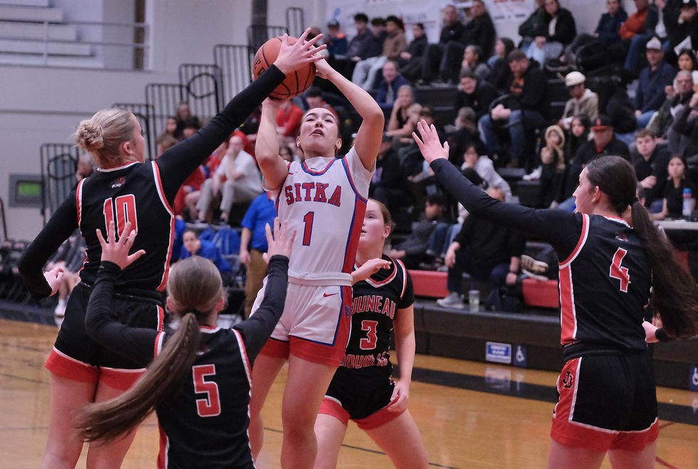 Juneau-Douglas High School: Yadaa.at Kalé sophomore Freyja Shelton-Walker (10), freshman Blythe Lockhart (5), senior Cambry Lockhart (3) and sophomore Sadie Lockhart (4) defend a shot by Sitka senior Ally Mayville (1) during the Crimson Bears' 58-46 win over the Lady Wolves at the George Houston Gymnasium on Saturday, Feb. 7, 2026. (Klas Stolpe / Juneau Independent)