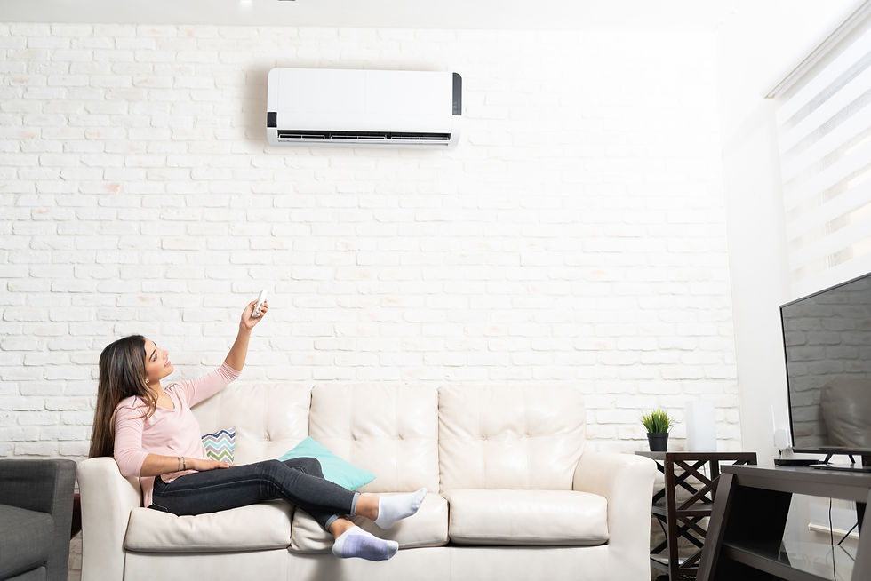 woman-turning-on-air-conditioner-at-home-2025-09-14-07-48-35-utc.jpg