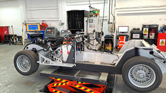 Car fitted with endine and electrc wiring