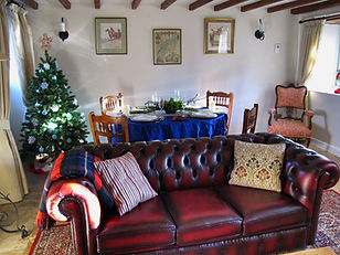 Christmas Tree in the sitting room behind sofa