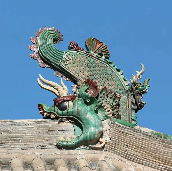 Chi Wen Image on top of a roof