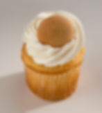 A vanilla wafer bottom below a moist banana cake, infused and stuffed with vanilla pudding, topped with vanilla buttercream and finished with a vanilla wafer.
