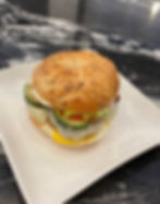 Egg or egg white, plant based sausage, pepper jack cheese, scallion spread, tomatoes, cucumbers, avocado, tomato preserves.