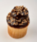 Our moist banana cake topped with a peanut butter buttercream pillow then hand dipped in our homemade ganache and sprinkled with peanuts.