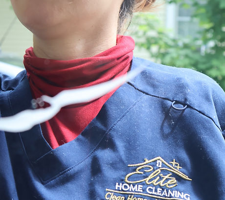 Elite Home Cleaning team member wearing a company uniform