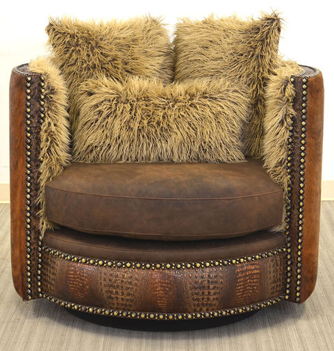 Rustic western and mountain style leather swivel chair with embossed leather and cowhide accent.