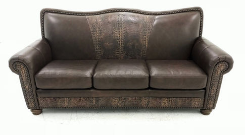 Rustic western and mountain style leather sofa with embossed leather accent.