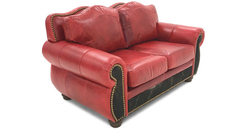 Rustic western and mountain style top grain leather loveseat with cowhide accent.