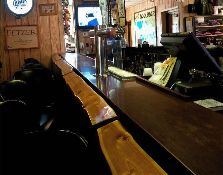 Bar interior with wooden counter and taps