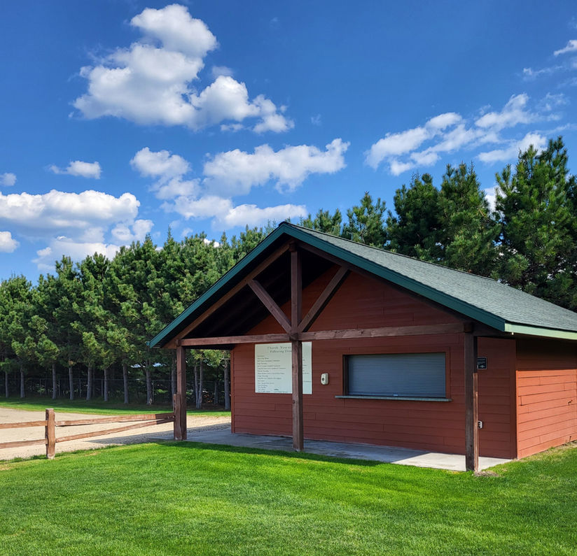 Red wooden concession stand building at Nyvall Field