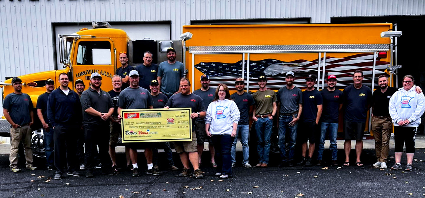 Group photo in front of Longville Area Fire Dept. building; City of Longville.