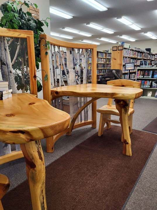 Wooden table and chairs inside library