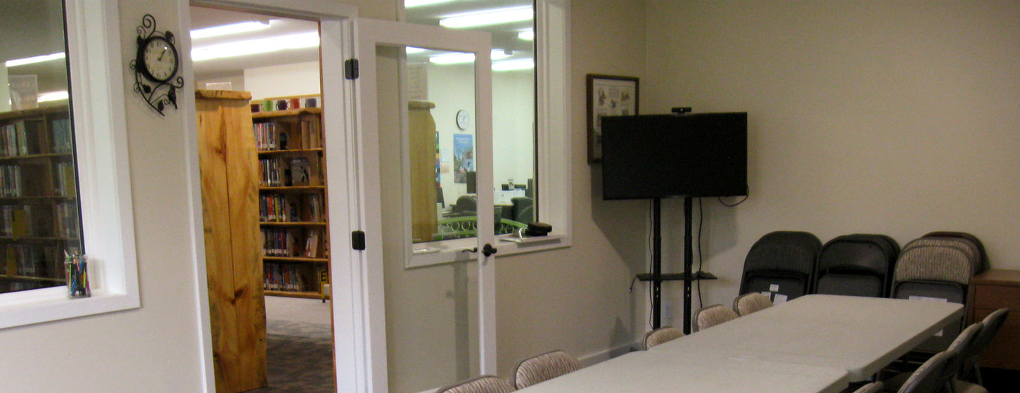Long table with chairs in room