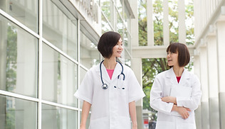 nurses talking in a hospital corridor