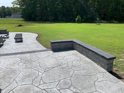 Stamped concrete patio with seating walls