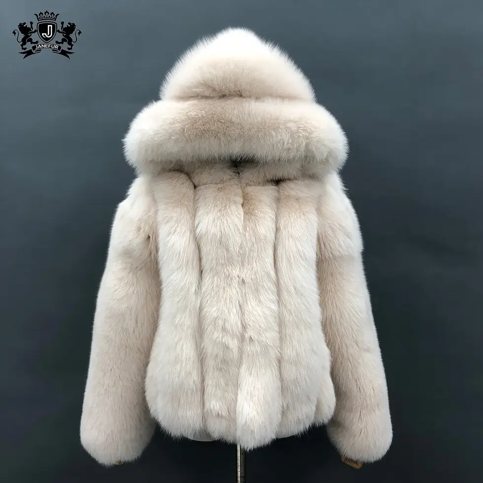 White cropped women’s real fox fur coat hanging on a rack.
