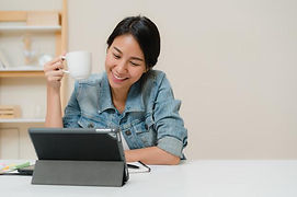 young-asian-woman-working-using-tablet-c
