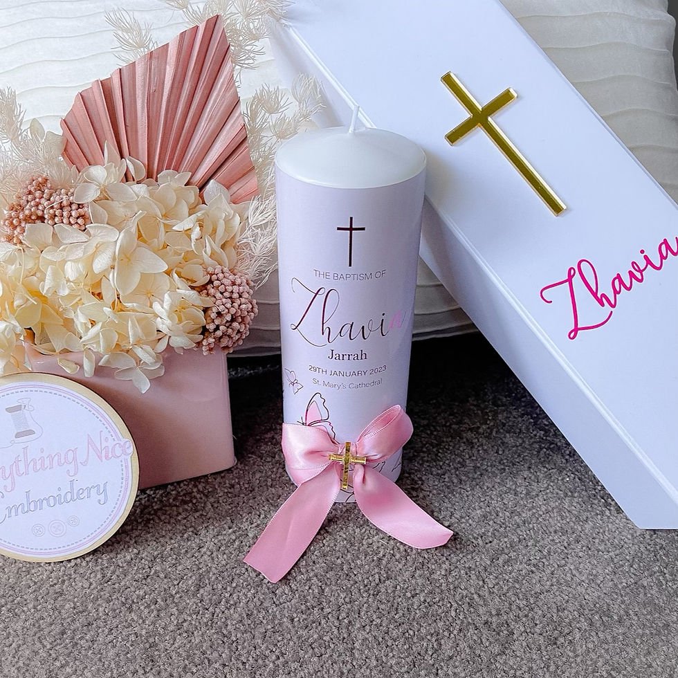 White rigid magnetic close candle box with a gold cross and pink vinyl text next to a baptism candle.