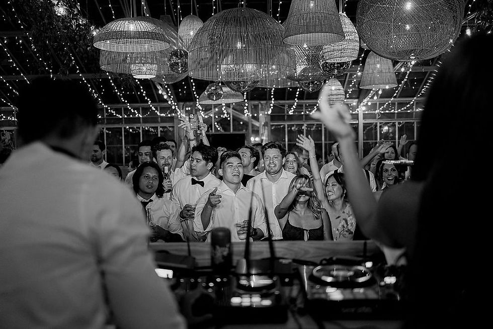 Eye-level view of DJ equipment setup at a wedding venue