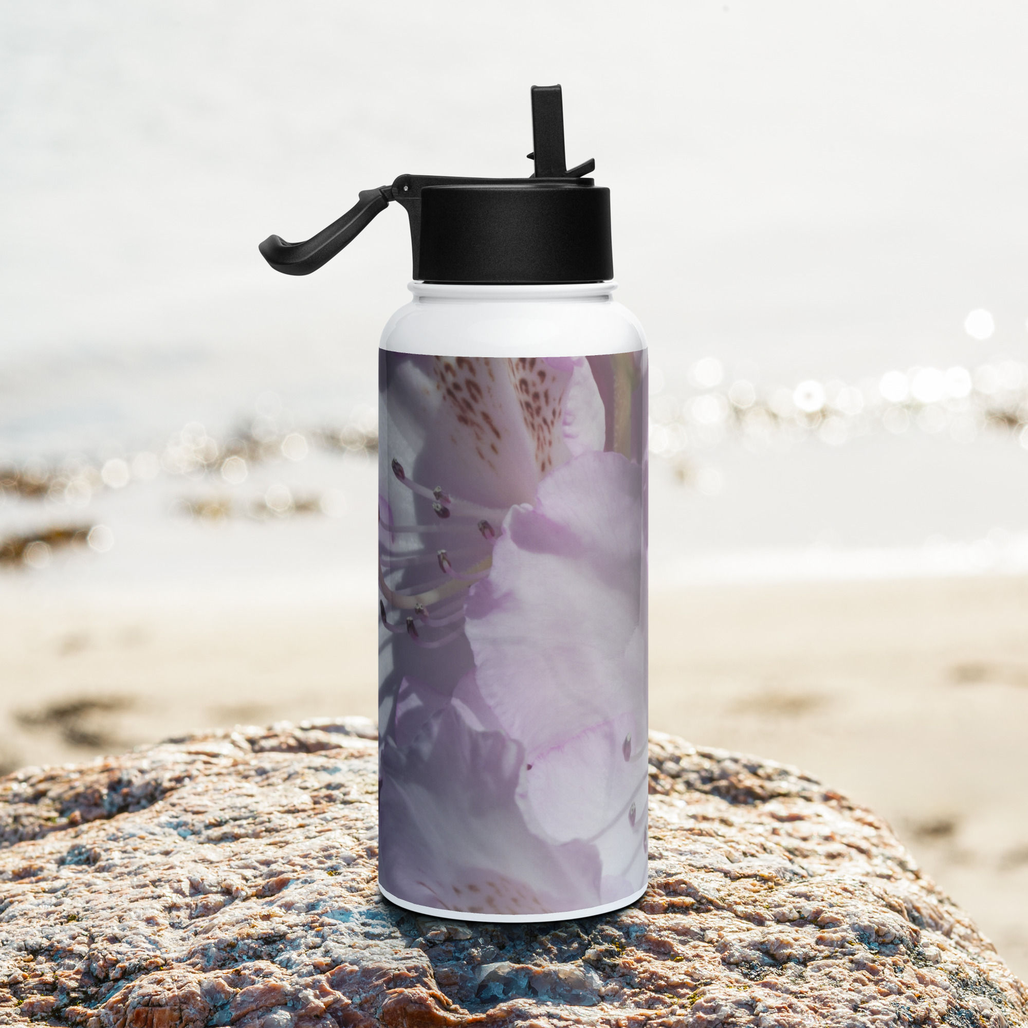 Stainless steel water bottle with a straw lid