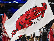 Arkansas reinstates tennis programs after emergency donor funding, AD says long-term solution still needed.