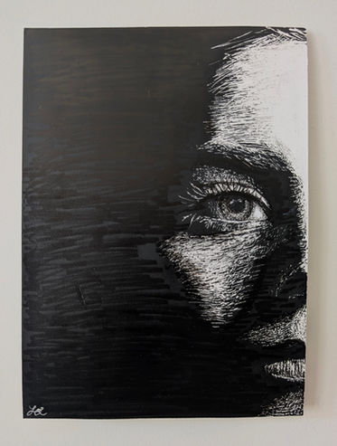 Abstract sketch of a face up close on scratchboard