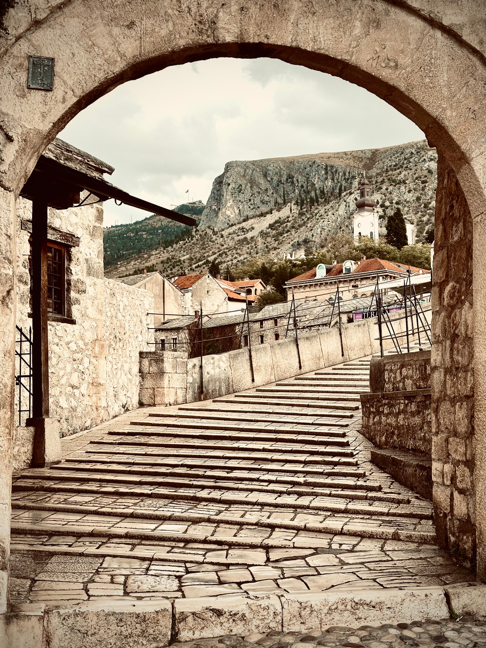 Cobbled Streets of Mostar: "The charming, cobbled streets of Mostar, lined with historic buildings and echoing with centuries of stories."