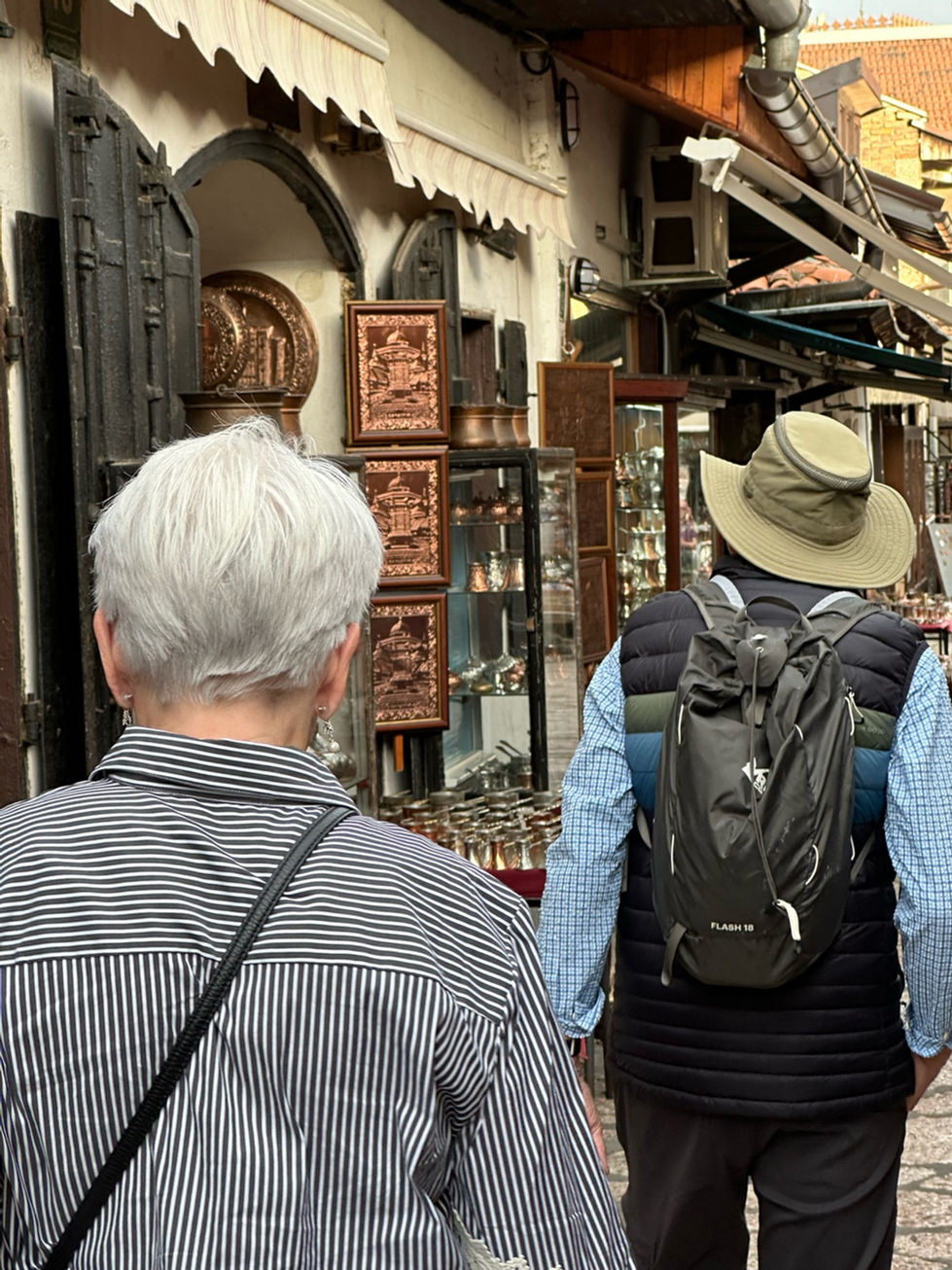 Traditional Bosnian Crafts in Baščaršija: "Artisans showcasing traditional Bosnian crafts in the Baščaršija bazaar, a hive of cultural activity."