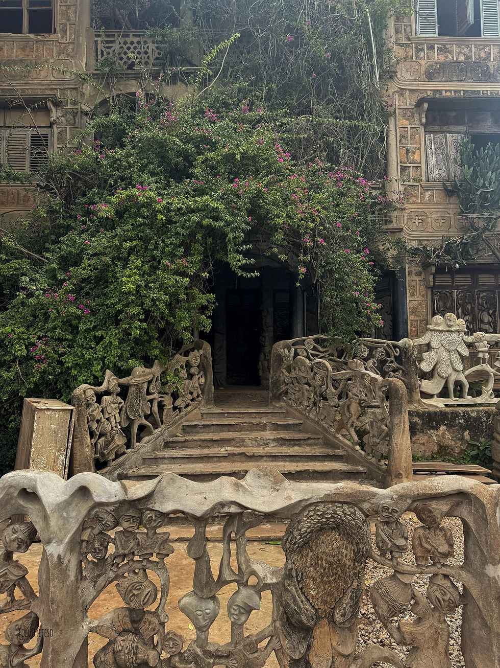 Stone stairway with sculpted Yoruba Orisha figures at Susanne Wenger’s house in Osogbo, Nigeria.