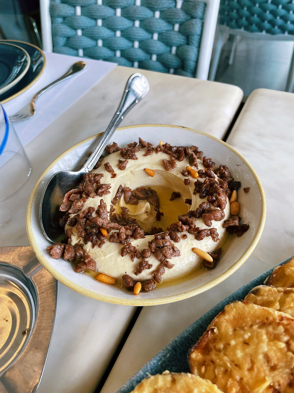 All the main ingredients are super foods in their own right. It's got chickpeas, sesame paste (tahini), garlic, and olive oil in most traditional versions.hummus with meat