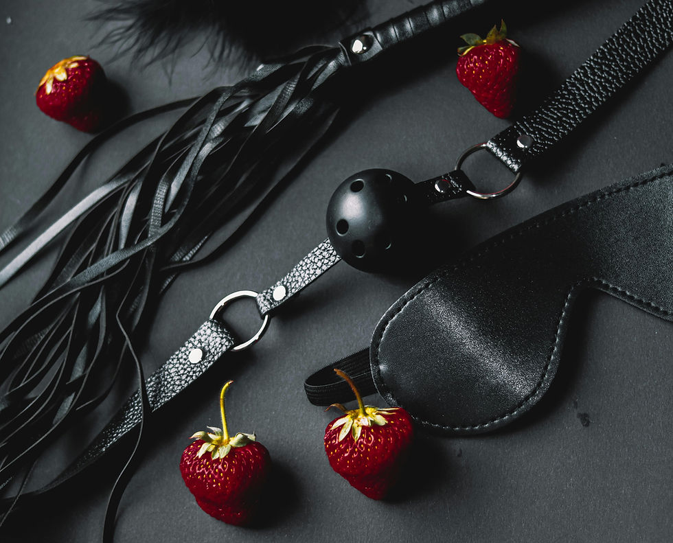 Black whip, ballgag and eye mask to highlight Why Do People Enjoy Kink?