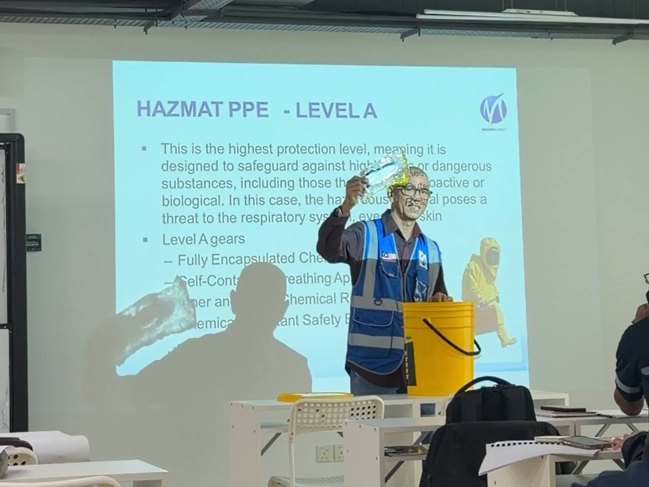 HAZMAT trainer delivering practical instruction on hazardous materials handling and emergency response procedures during HAZMAT Handling Training in Malaysia