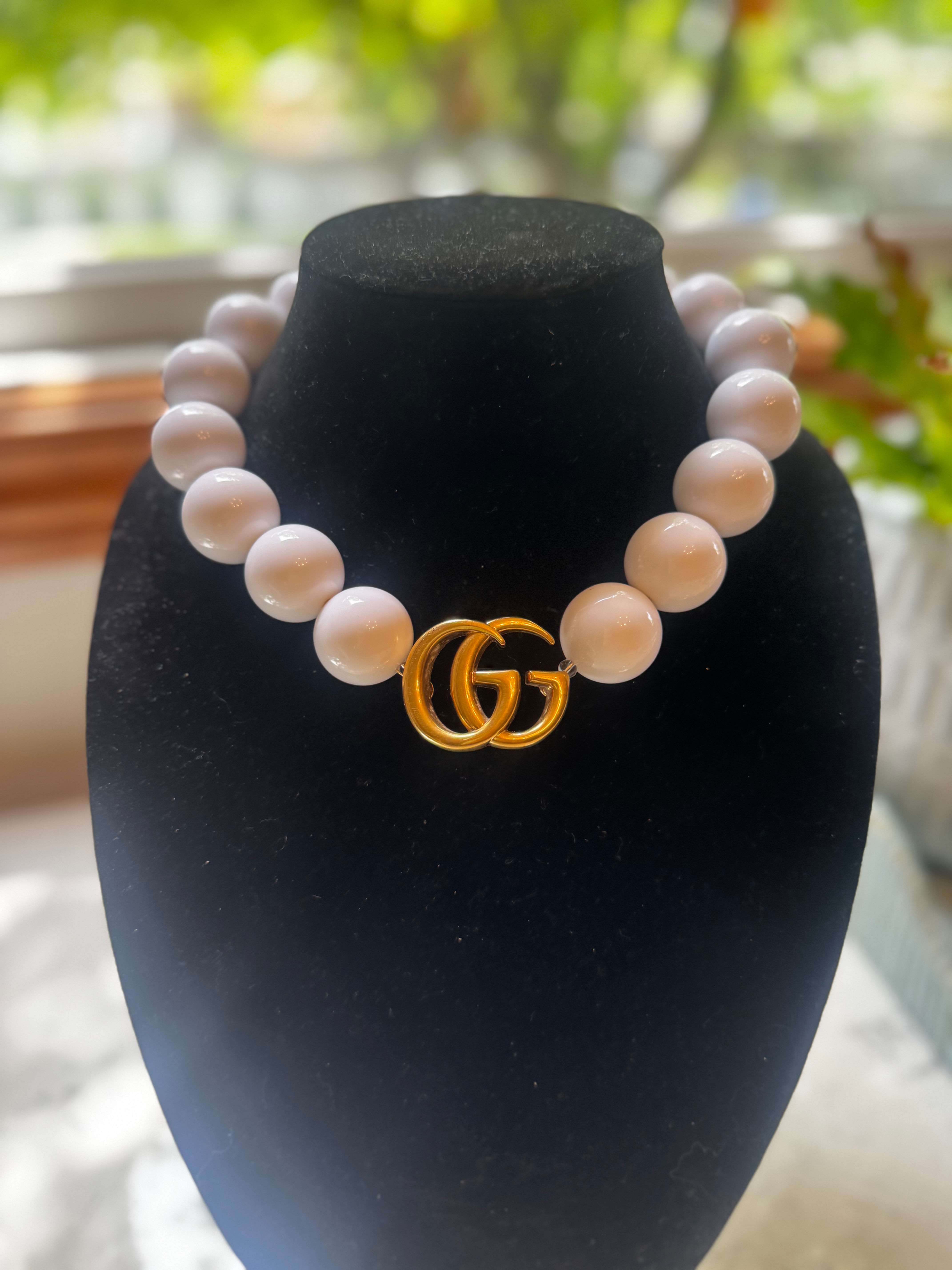 Gold tone GG on large white bead ne kla e