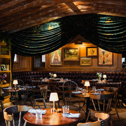 Full living room interior with tables and booths