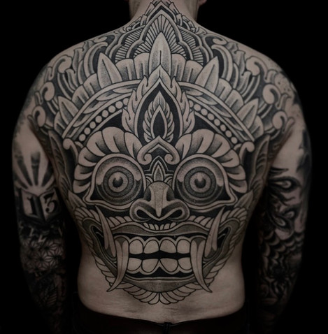 Barong mask tattoo on back