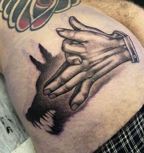 shadow puppet tattoo