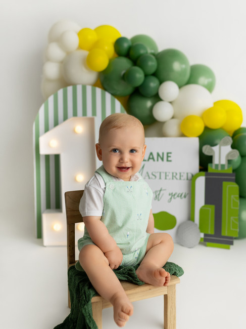 one year old golf theme birthday portrait