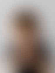 4 year old birthday boy eating cupcake portrait