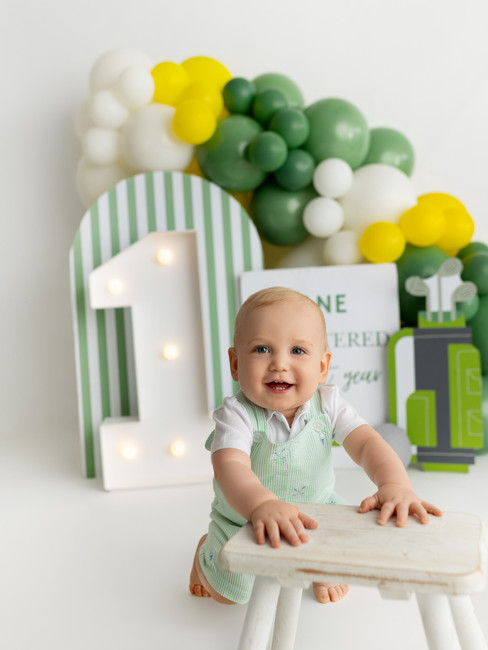 baby boy propping on stool - one year birthday portraits