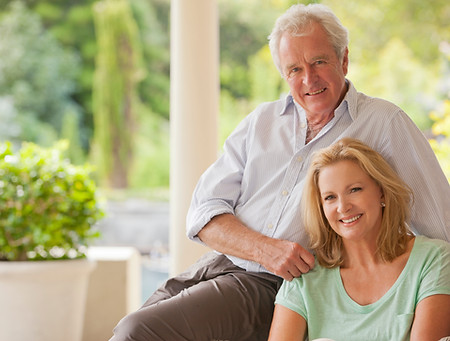 Portrait of smiling couple on porch.jpg