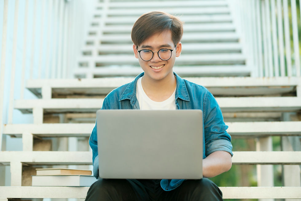 Student preparing for UAV exam using laptop